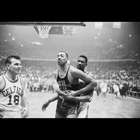 Wilt Chamberlain Holding Back Bill Russell