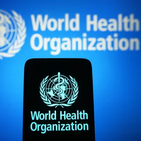 In this photo illustration, the World Health Organization (