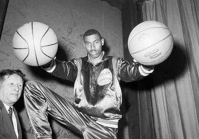 Wilt Chamberlain Holding Two Basketballs