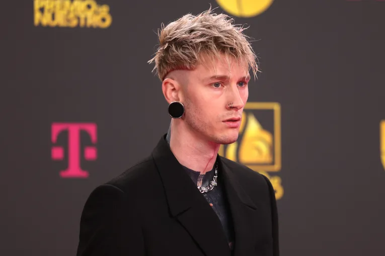 Machine Gun Kelly Takes Fans Behind The Scenes Of His Blackout Tattoo